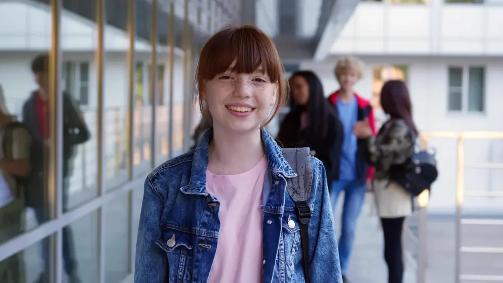 a girl at school smiling